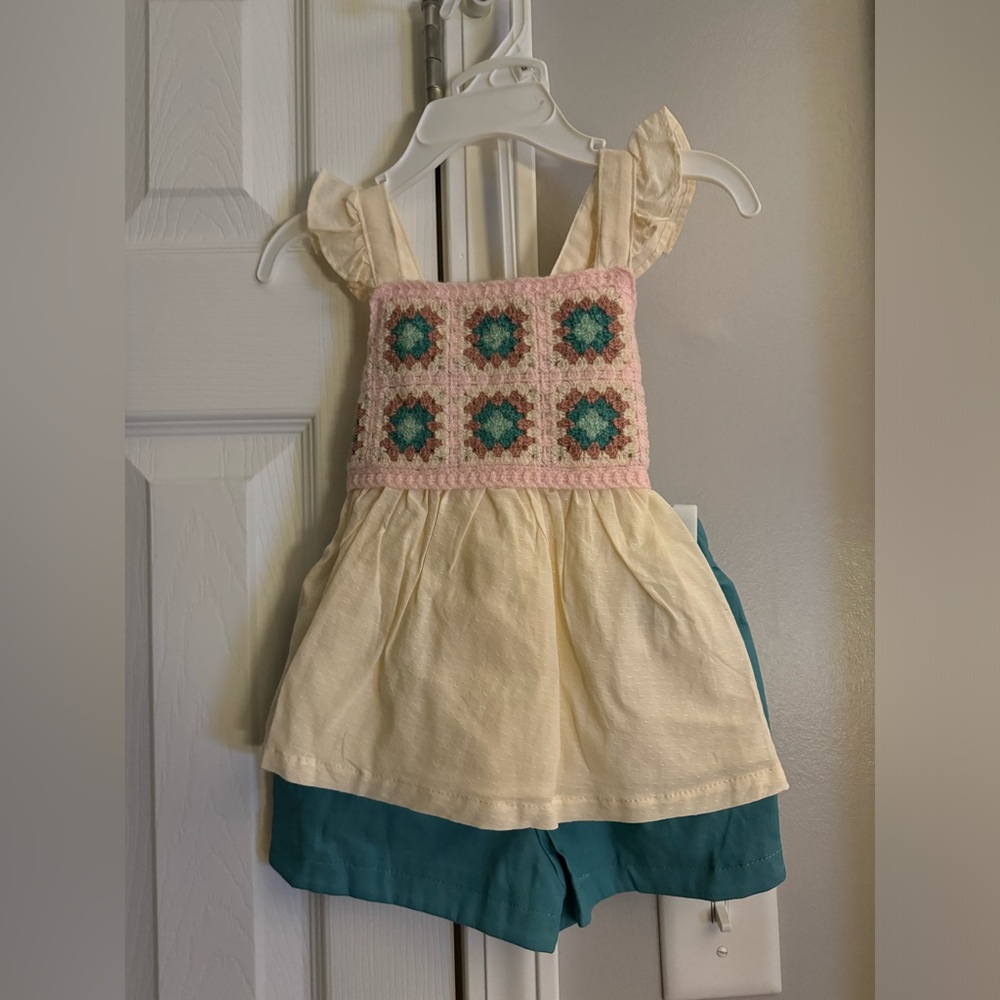 A pair of shorts with a crotchet top